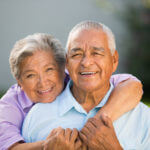 Happy older couple enjoying their home space.