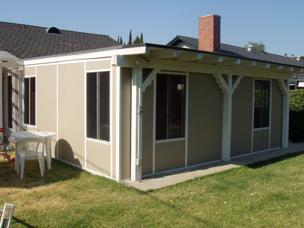 A white and gray patio enclosure built by upscale Los Angeles design-build firm A-List Builders, serving Los Angeles. Let us handle your upcoming home remodel.