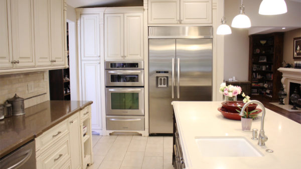 Chandler Estates kitchen remodel with large kitchen island, bar seating, and designer finishes in Sherman Oaks, CA.