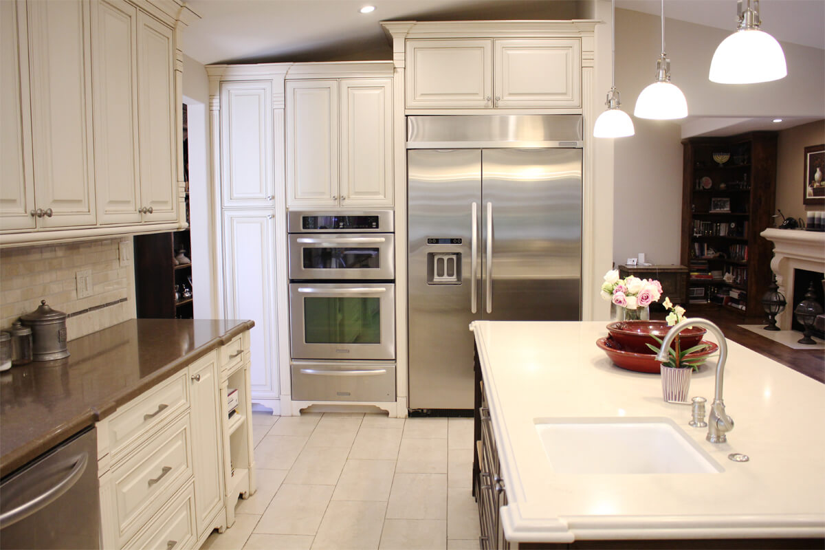 Chandler Estates kitchen remodel with large kitchen island, bar seating, and designer finishes in Sherman Oaks, CA.