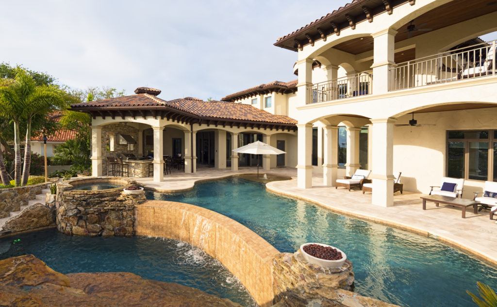 Outside area of a luxury Mediterranean-style estate in Los Angeles with pool