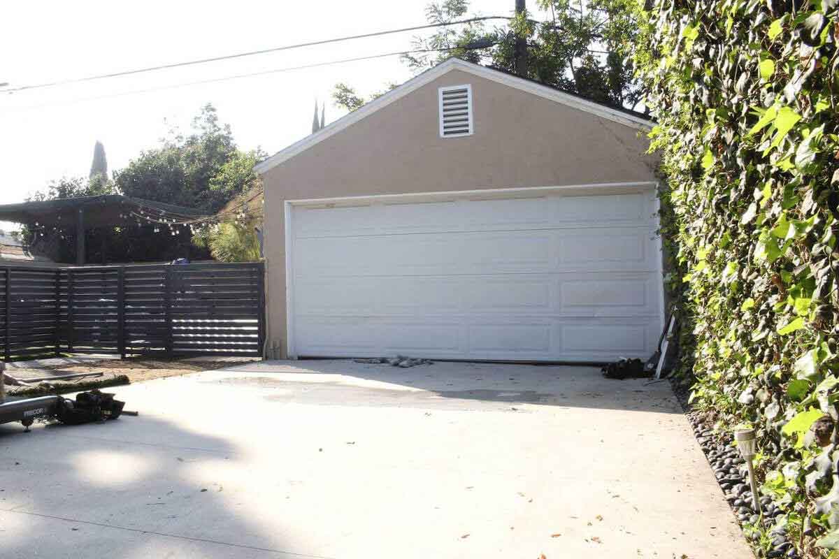 A before image of a garage in a home in Beverlywood, CA, prior to a complete custom remodel by Los Angeles design-build firm A-List Builders.