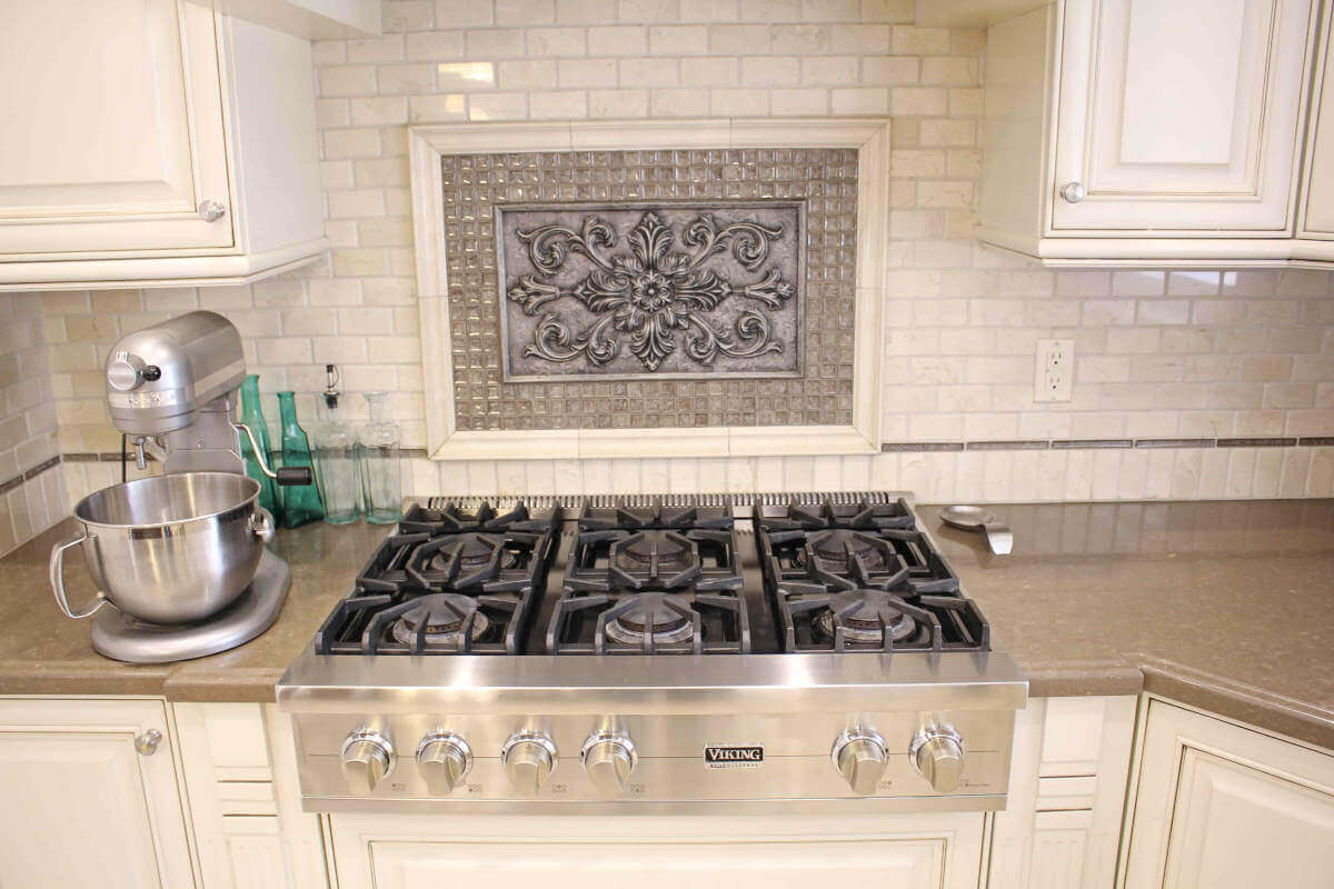 Light, cream colored accents dominate this kitchen remodel at a home in Sherman Oaks, CA, completed by upscale Los Angeles design-build firm A-List Builders.