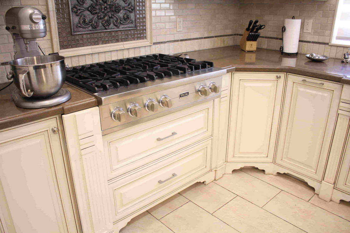 An upscale stove top range with custom cabinetry, part of a home remodel in Sherman Oaks, CA by Los Angeles design-build firm A-List Builders.