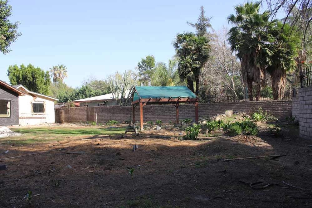 A before image of a back yard on a property in Sherman Oaks, CA, prior to a complete home remodel by Los Angeles design-build firm A-List Builders.