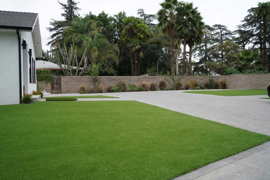 The large, well manicured grounds in front of a Sherman Oaks, CA home, part of a home remodel by upscale Los Angeles design-build firm A-List Builders.