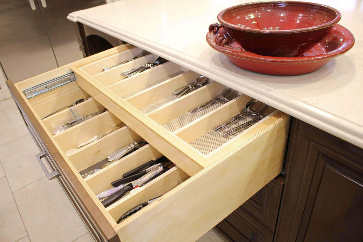 A large drawer for silverware in a newly remodeled kitchen at a home in Sherman Oaks, CA, part of a home remodel by LA design-build firm A-List Builders.