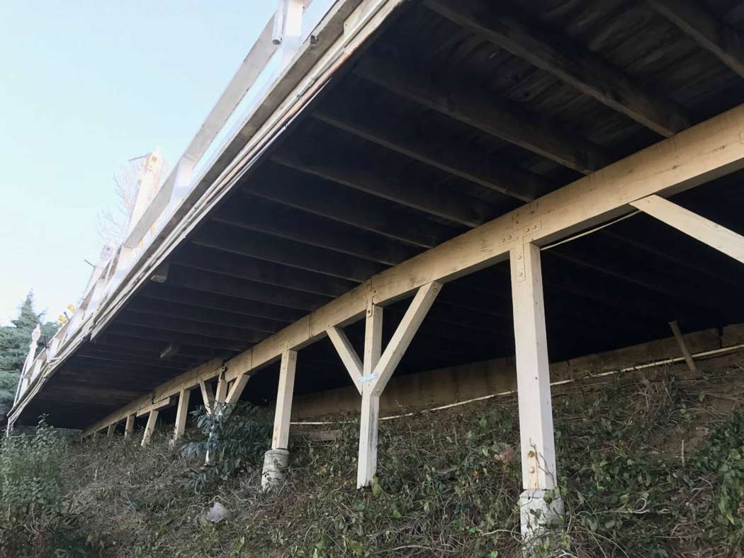 The dilapidated underside of a hillside deck in Studio City, CA, prior to being demolished and rebuilt by upscale Los Angeles design-build firm A-List Builders.