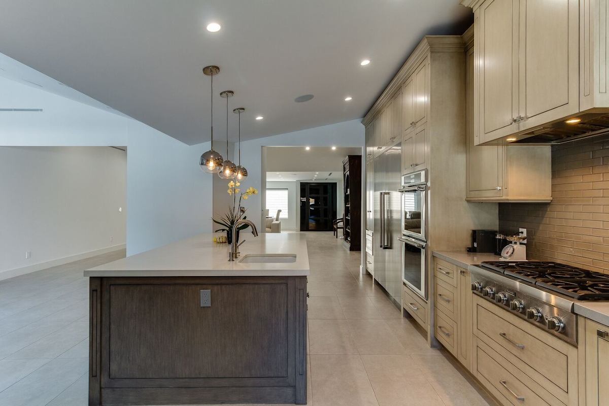New cabinets, appliances, and fixtures in a kitchen at a home in Sherman Oaks, CA, part of a home remodel by Los Angeles design-build firm A-List Builders.