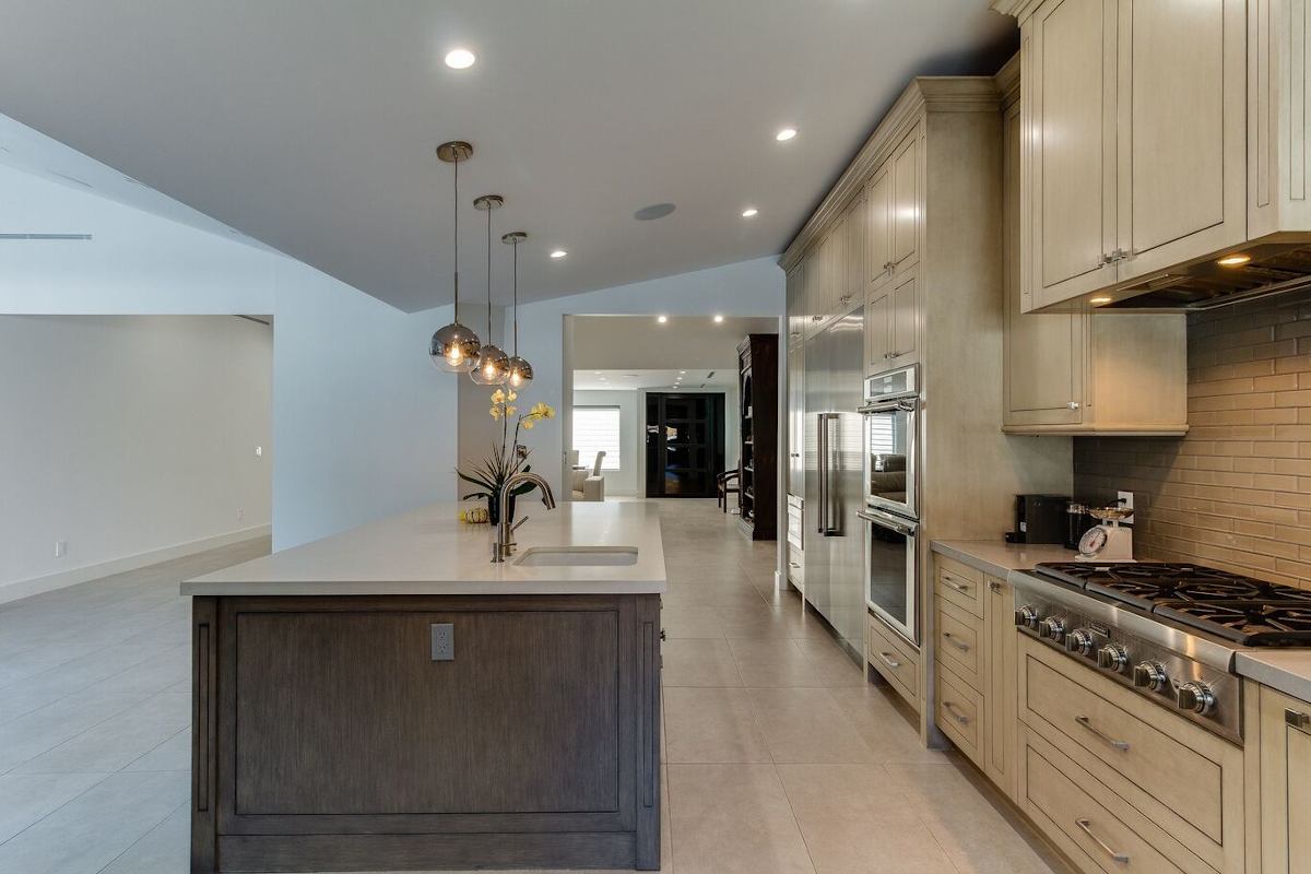 New cabinets, appliances, and fixtures in a kitchen at a home in Sherman Oaks, CA, part of a home remodel by Los Angeles design-build firm A-List Builders.