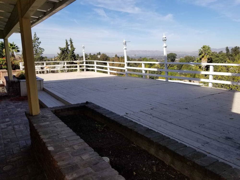 A deck on a home in Studio City, CA is stripped bare prior to being demolished and rebuilt by upscale Los Angeles design-build firm A-List Builders.