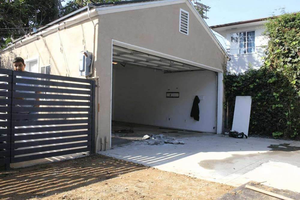 A garage in a home in Beverlywood, CA is cleared out prior to a major renovation by Los Angeles design-build firm A-List Builders.