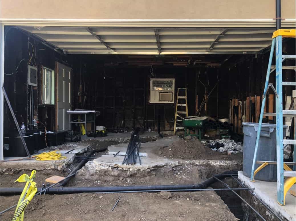 The old foundation is torn out of a garage at a home in Beverlywood, CA, part of a home remodel by Los Angeles design-build firm A-List Builders.