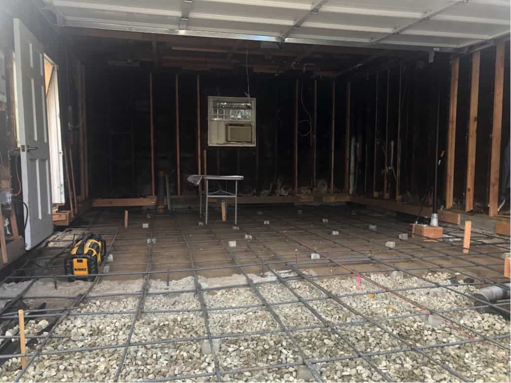A new foundation in the early stages of construction, part of a home remodel in Beverlywood, CA by Los Angeles design-build firm A-List Builders.