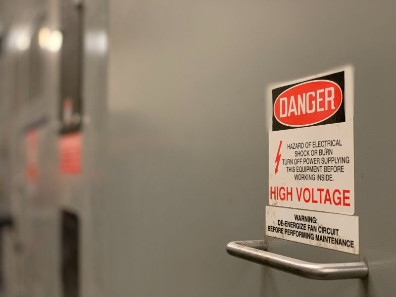 Electrical box with a “high voltage” warning.