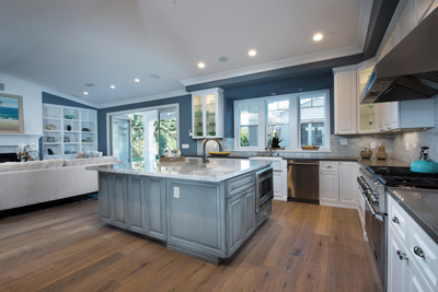 Large Blue-Toned Kitchen with Island Table in a Studio City home remodel