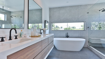 White and Grey Bathroom with Ocean-Themed Shower Curtain