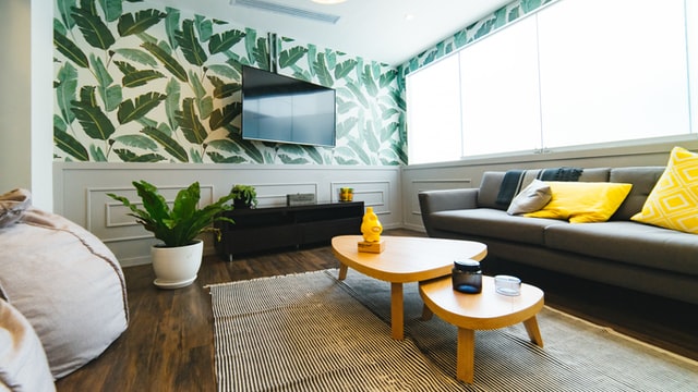 Photo of a newly renovated home in Santa Monica, CA with Pantone yellow and gray furnishings and new hardwood floors.