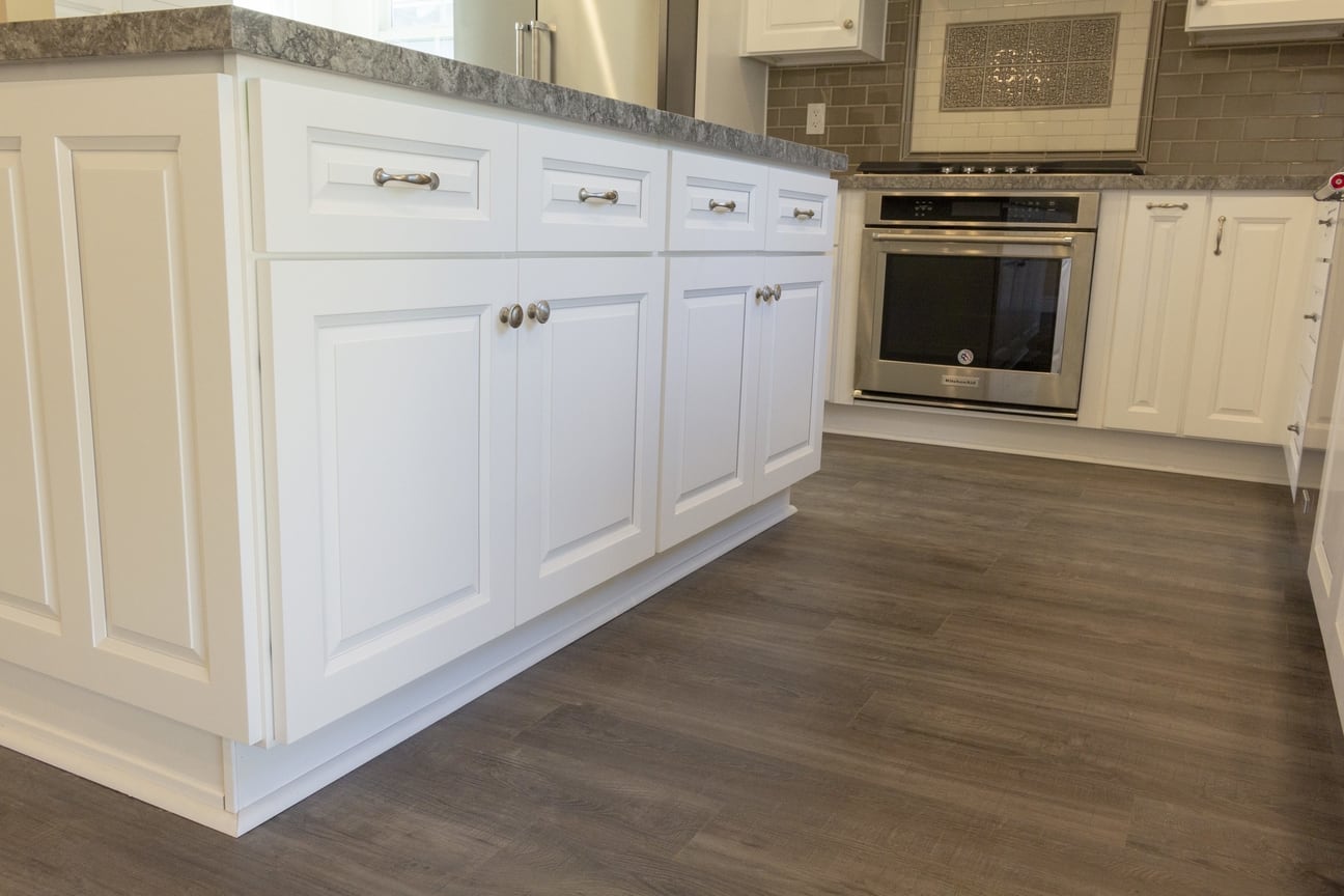 New floors and kitchen island base cabinets, part of a complete home remodel in Burbank, California by design-build firm A-List Builders, serving Los Angeles.