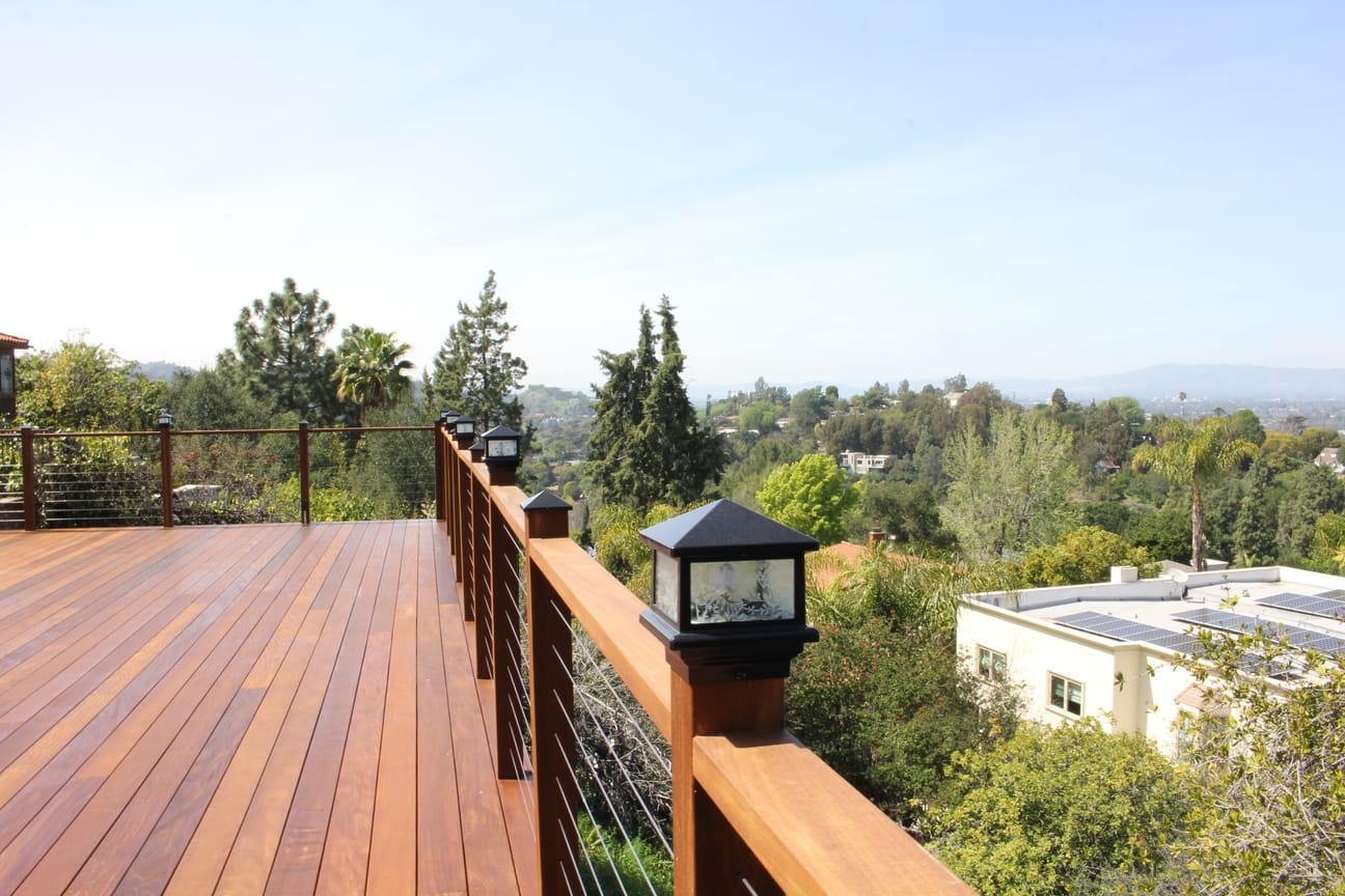 A new custom built hardwood deck with perimeter lighting and outstanding views at a home in Studio City, CA, by Los Angeles design-build firm A-List Builders.