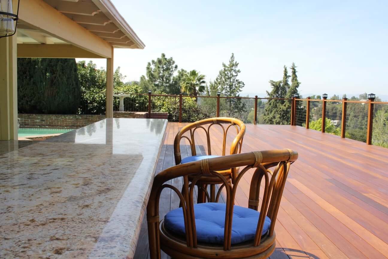 A deck and swimming pool in Studio City, CA, part of a home remodel by Los Angeles design-build firm A-List Builders.