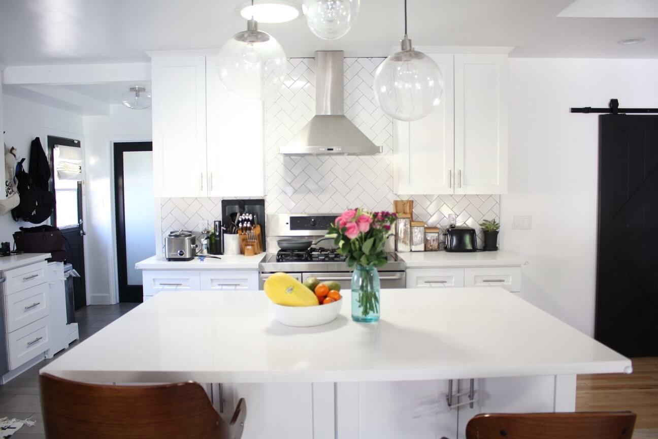 A light and cozy kitchen with white colors, part of an Encino, California home remodel by design-build firm A-List Builders, serving all of Los Angeles.