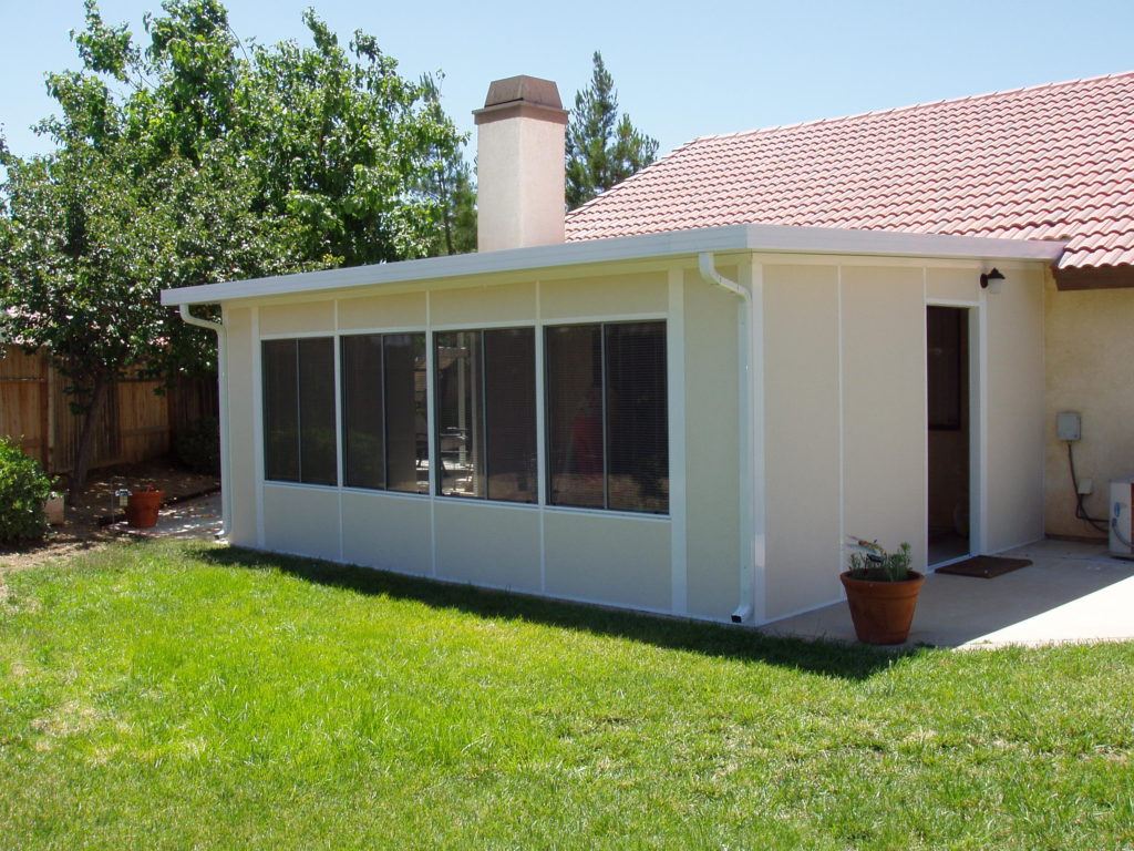 A backyard patio remodeled into an enclosed patio. Add a patio enclosure to your home with design-build firm A-List Builders, serving all of Los Angeles.